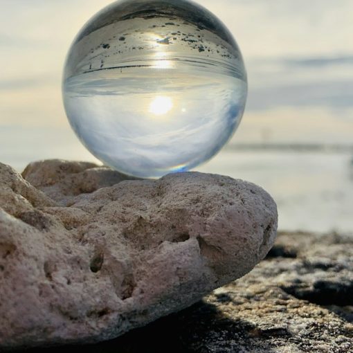 Clear glass ball on brown rock, illustrating cloud computing predictions for 2011