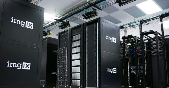 Rows of black server racks with white logos in a data center, illustrating inside AT&T cloud computing centers