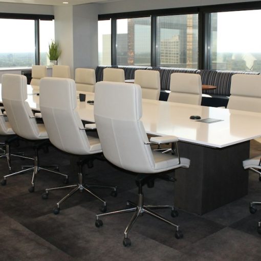 Empty boardroom with white office chairs, illustrating board of directors cloud governance