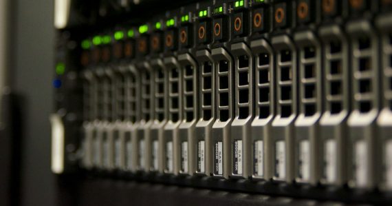 Server rack with blinking green lights, illustrating virtualization and IT management