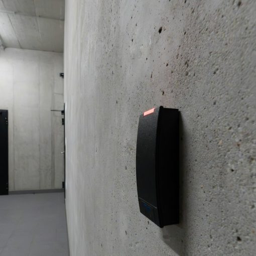 A card reader beside a dark door, illustrating cloud access management policies