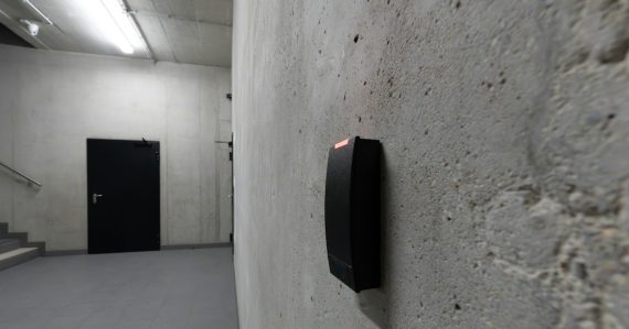 A card reader beside a dark door, illustrating cloud access management policies