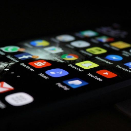 Smartphone screen full of app icons, illustrating how cloud computing changes application delivery
