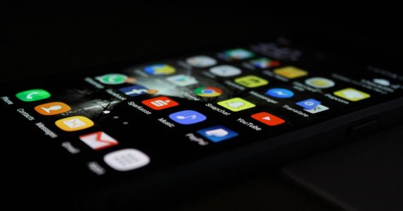 Smartphone screen full of app icons, illustrating how cloud computing changes application delivery
