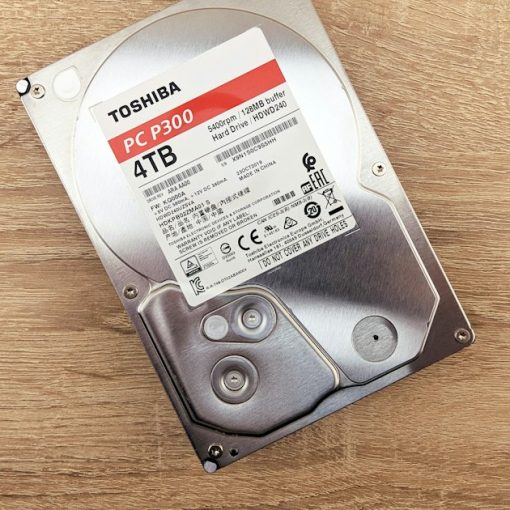 A hard drive sitting on top of a wooden table, illustrating cloud backup adoption