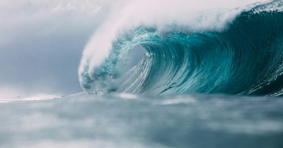 White and blue ocean waves, illustrating business communications moving to the cloud