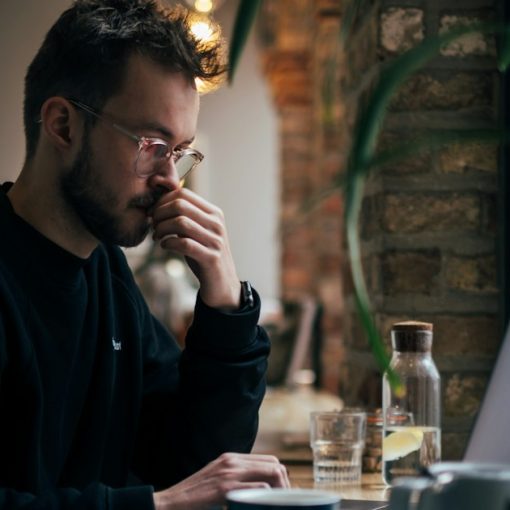 Man using a laptop, illustrating early adopters disappointed by cloud computing