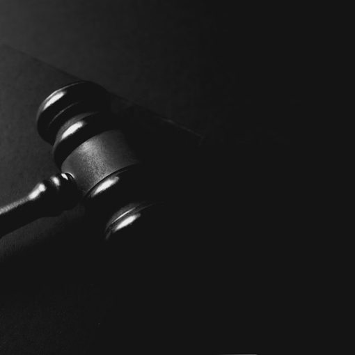 A gavel rests on a dark background, illustrating litigating cloud computing disputes