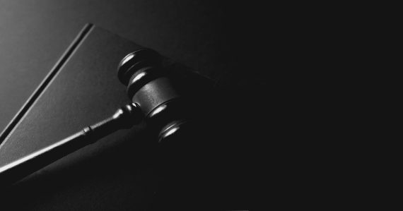A gavel rests on a dark background, illustrating litigating cloud computing disputes