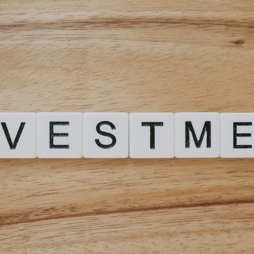 Investment spelled in letter tiles, illustrating investing in cloud computing ventures