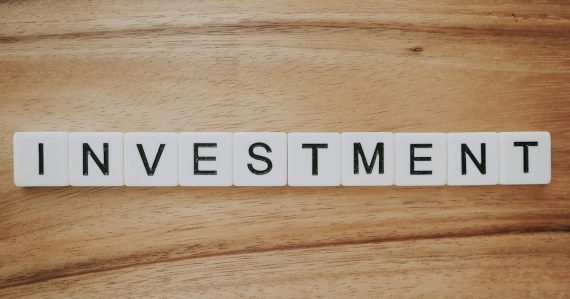 Investment spelled in letter tiles, illustrating investing in cloud computing ventures