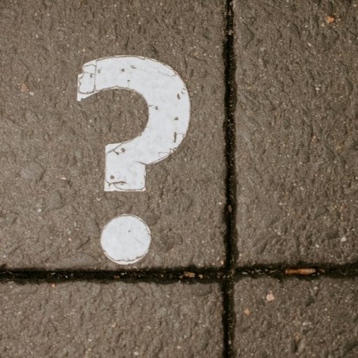 White question mark painted on pavement, illustrating cloud computing myths