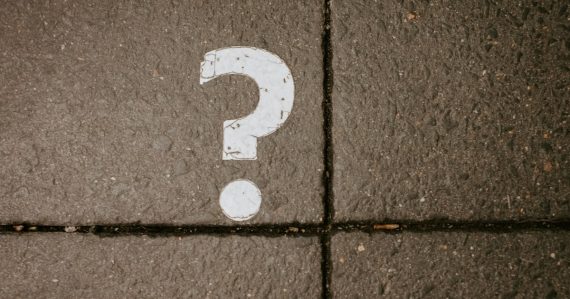 White question mark painted on pavement, illustrating cloud computing myths
