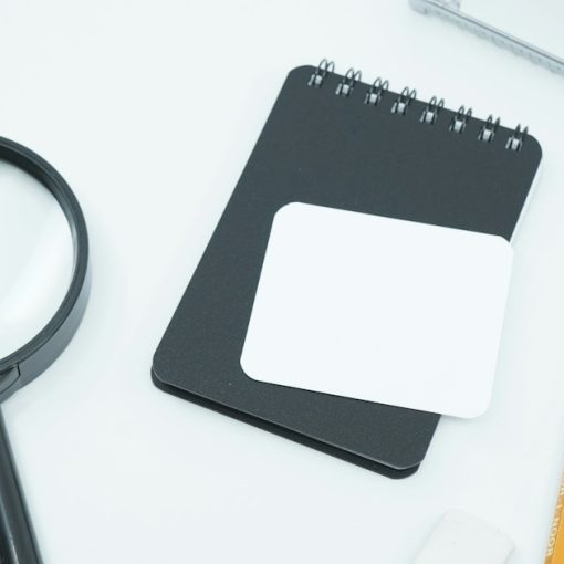 Black magnifying glass on white paper, illustrating cloud computing myths