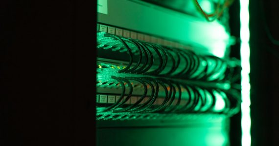 A close up of a server in a server room, illustrating cloud data security and privacy