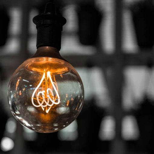 Macro photography of clear light bulb, illustrating cloud computing driven by innovation