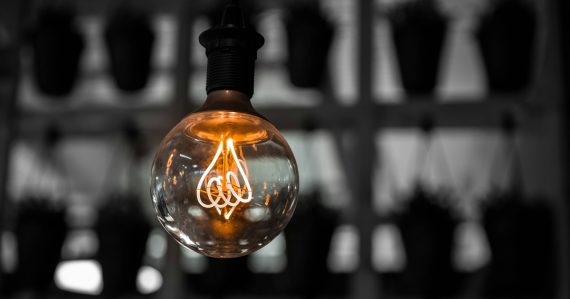 Macro photography of clear light bulb, illustrating cloud computing driven by innovation
