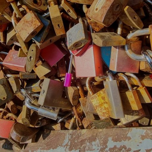 A bunch of locks that are on a wall, illustrating cloud encryption options