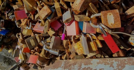 A bunch of locks that are on a wall, illustrating cloud encryption options