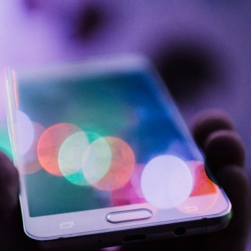Person holding smartphone, illustrating cloud computing as key to mobile broadband