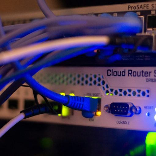 Close up of network cables connected to a switch, illustrating the state of cloud networking