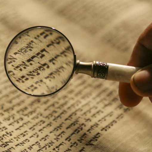 Person holding magnifying glass, illustrating vetting cloud provider partners
