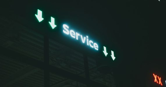 A lit up service sign, illustrating customer demands on cloud providers