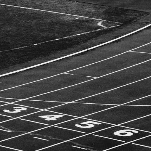 A black and white photo of a running track, illustrating cloud readiness for businesses