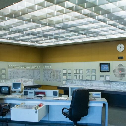 A control room with a desk and two chairs, illustrating nimbler management of cloud services