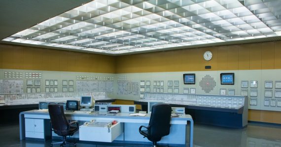 A control room with a desk and two chairs, illustrating nimbler management of cloud services