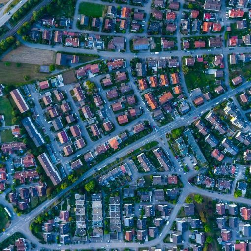 Aerial photography of houses and buildings, illustrating cloud sprawl