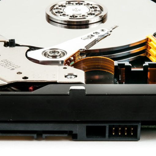 Open hard drive on a white surface, illustrating cloud storage best practices