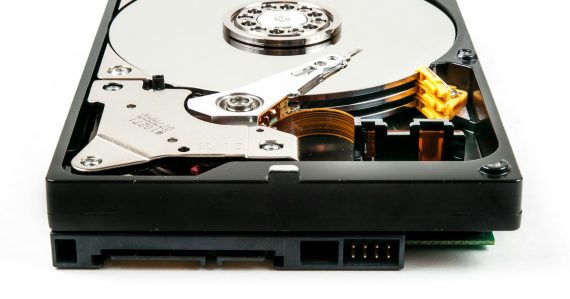 Open hard drive on a white surface, illustrating cloud storage best practices
