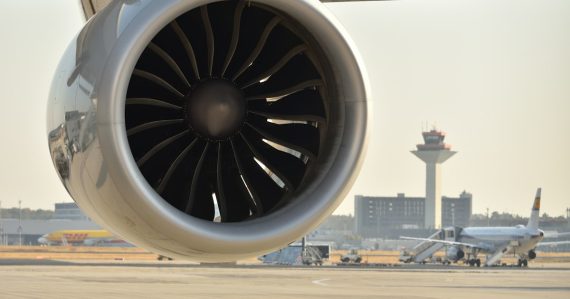 A large jet engine sitting on an airport tarmac, illustrating supercomputing in the cloud