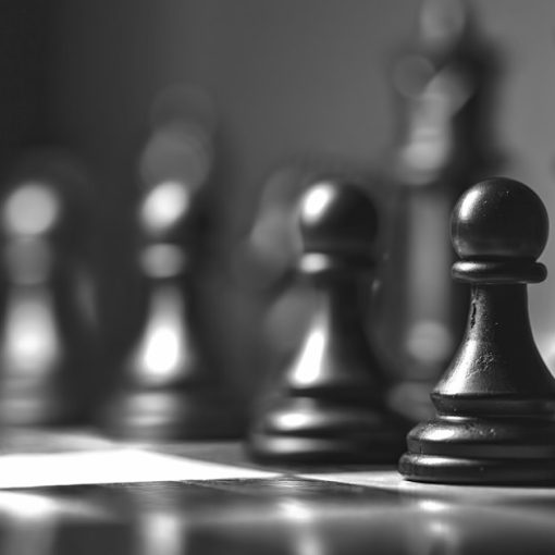 Black chess piece on chess board, illustrating cloud computing changing corporate strategy