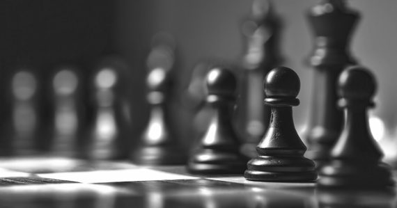 Black chess piece on chess board, illustrating cloud computing changing corporate strategy