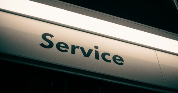 A sign with the word Service in black letters on a white background, illustrating CRM in the cloud