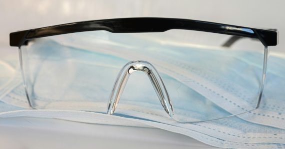 Black framed eyeglasses on white textile, illustrating executive expectations on virtualization