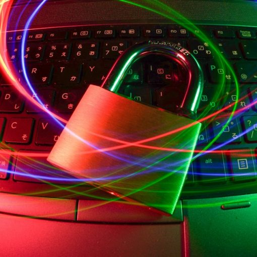 Padlock on laptop with light trails, illustrating the Dallas cybersecurity industry