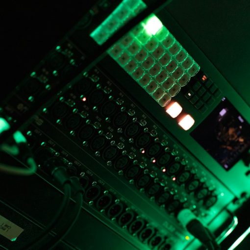 A close up of a computer in a dark room, illustrating federal data center consolidation