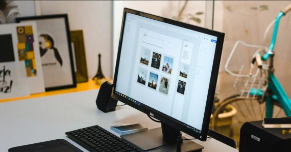 Black flat screen computer monitor and black computer keyboard, illustrating the future of the desktop