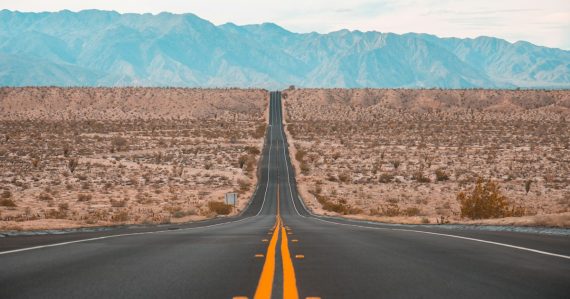 Long exposure photography of a concrete road on open land, illustrating desktop virtualization rollouts