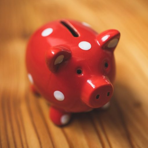 Pink and black ceramic piggy bank, illustrating the economics of desktop virtualization