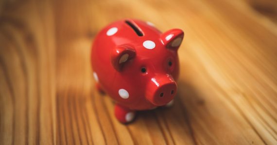 Pink and black ceramic piggy bank, illustrating the economics of desktop virtualization