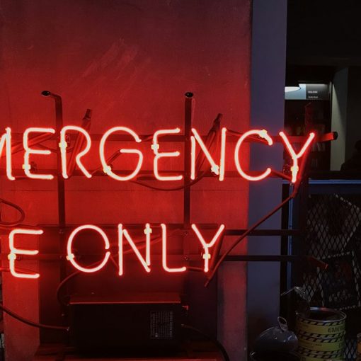 A neon sign that reads emergency use only, illustrating disaster recovery in the cloud