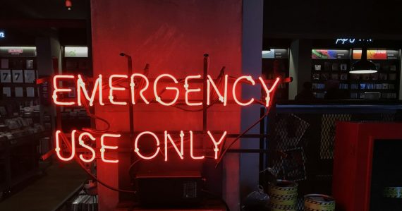 A neon sign that reads emergency use only, illustrating disaster recovery in the cloud
