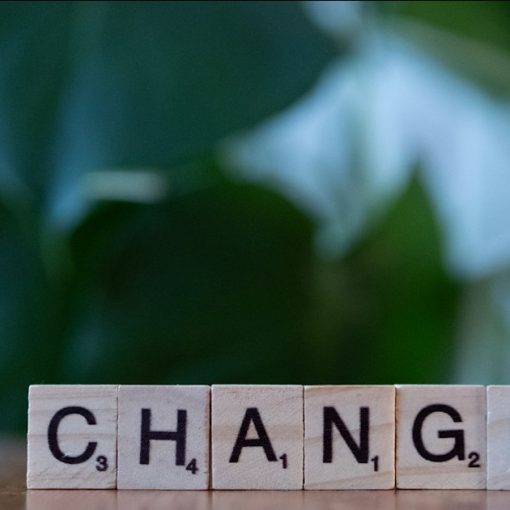 Letter blocks spelling change on a table, illustrating cloud computing disruption to IT practices