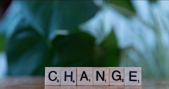 Letter blocks spelling change on a table, illustrating cloud computing disruption to IT practices