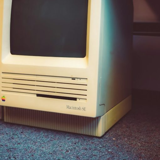 An old computer sitting on the floor next to a wall, illustrating the cloud replacing the PC