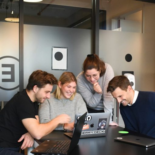People sitting on chair in front of laptop computers, illustrating enterprise application strategy with the cloud
